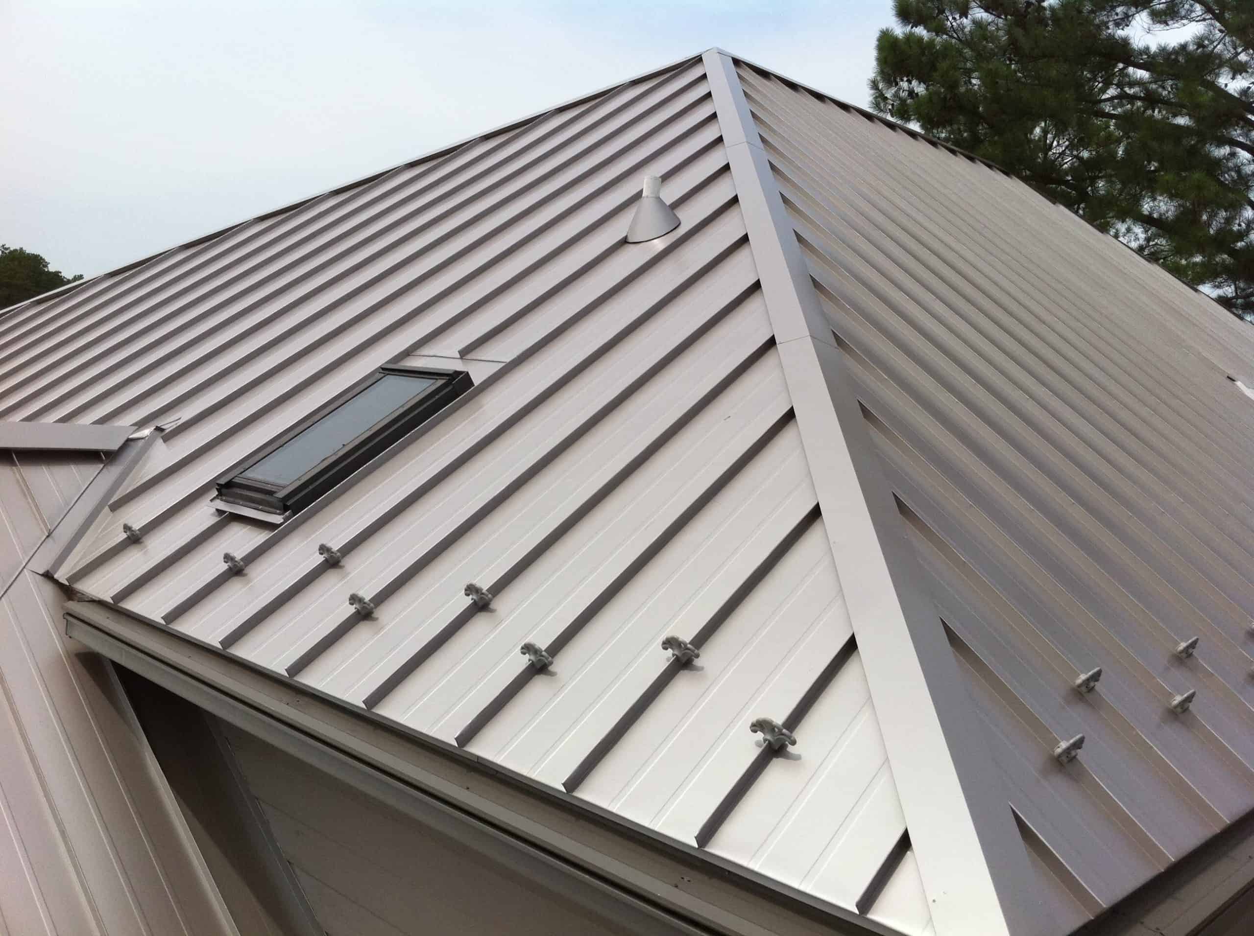 Standing seam metal roof with snow guards and skylight installed on a Minnesota home by First Impressions Exteriors