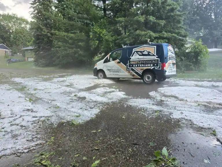 Photo showing First Impressions inspecting for damage after hailstorm in Roseville