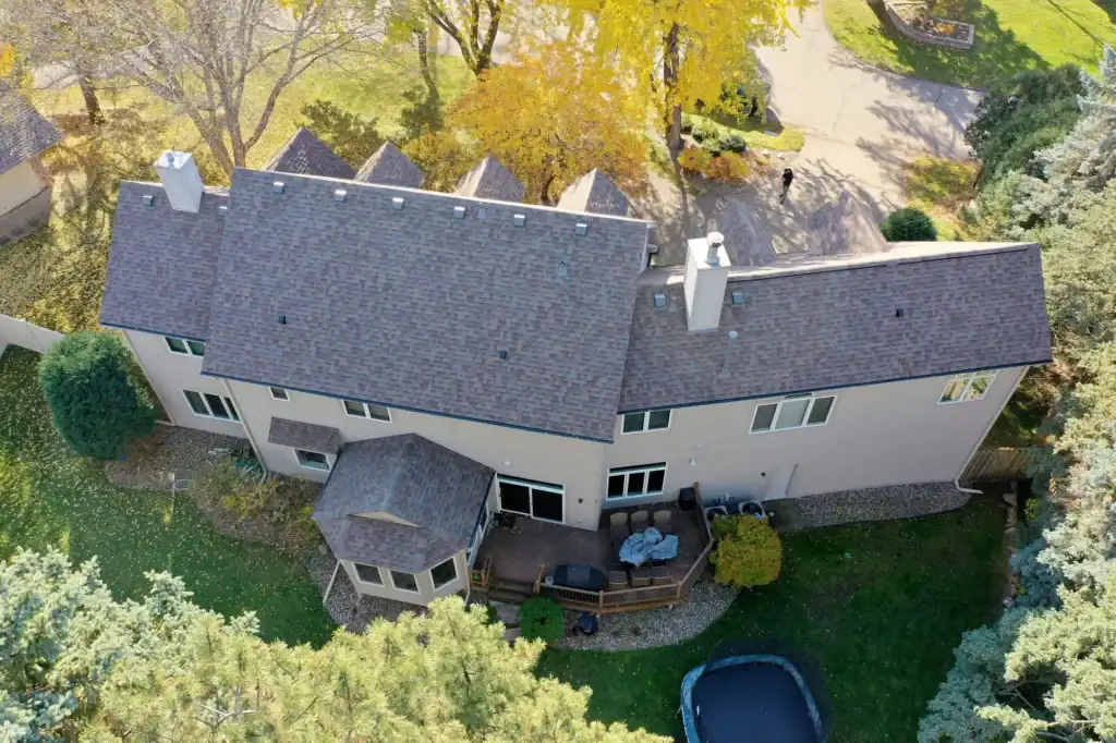 Completed Malarkey Vista AR Natural Wood roof replacement in Minnetonka, MN shown from a drone aerial view