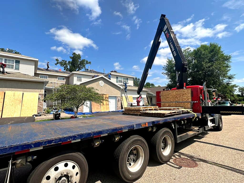 Roofing contractor in Minnesota installing architectural shingles on a Twin Cities home