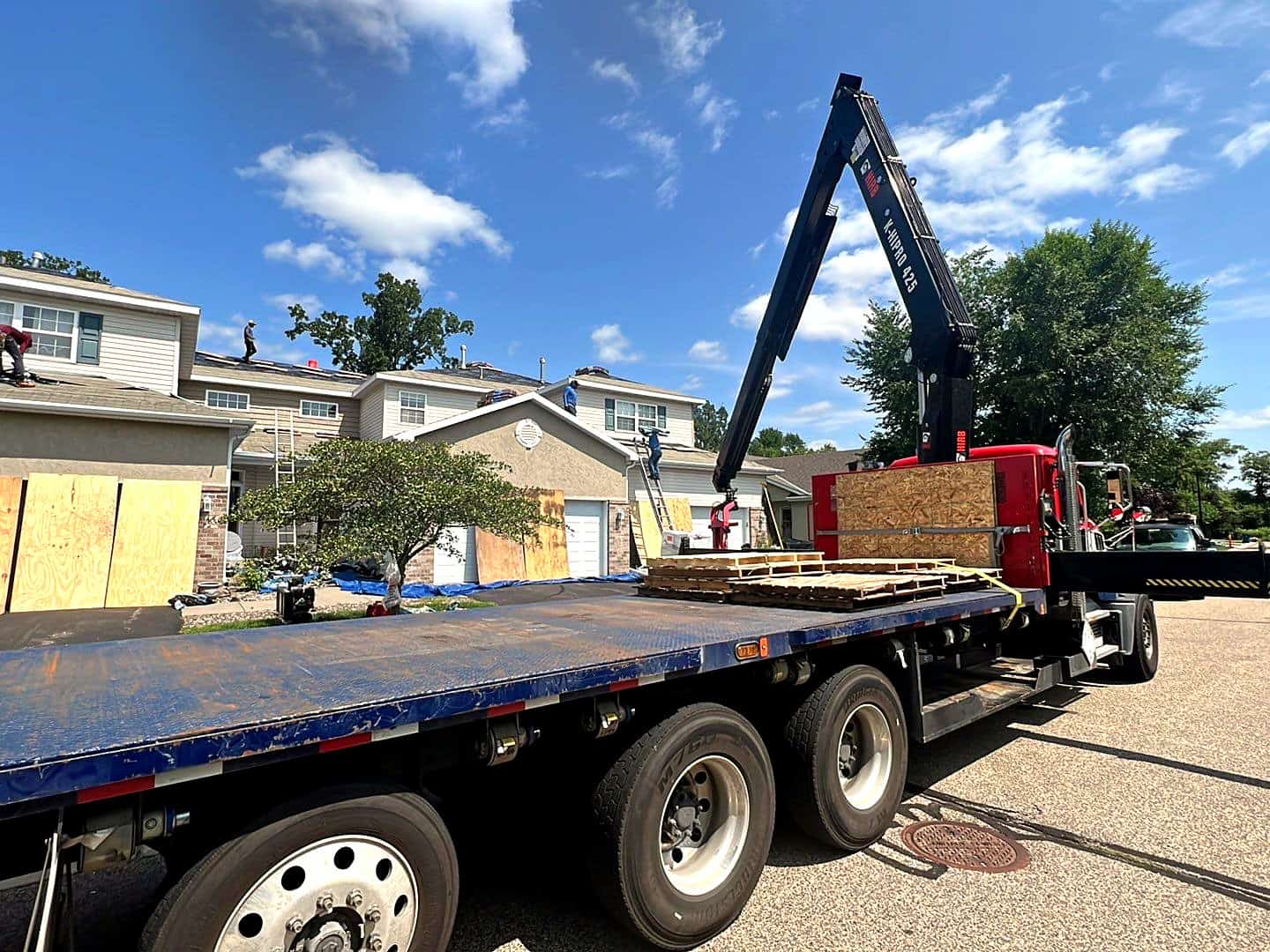 Roofing contractor in Minnesota installing architectural shingles on a Twin Cities home