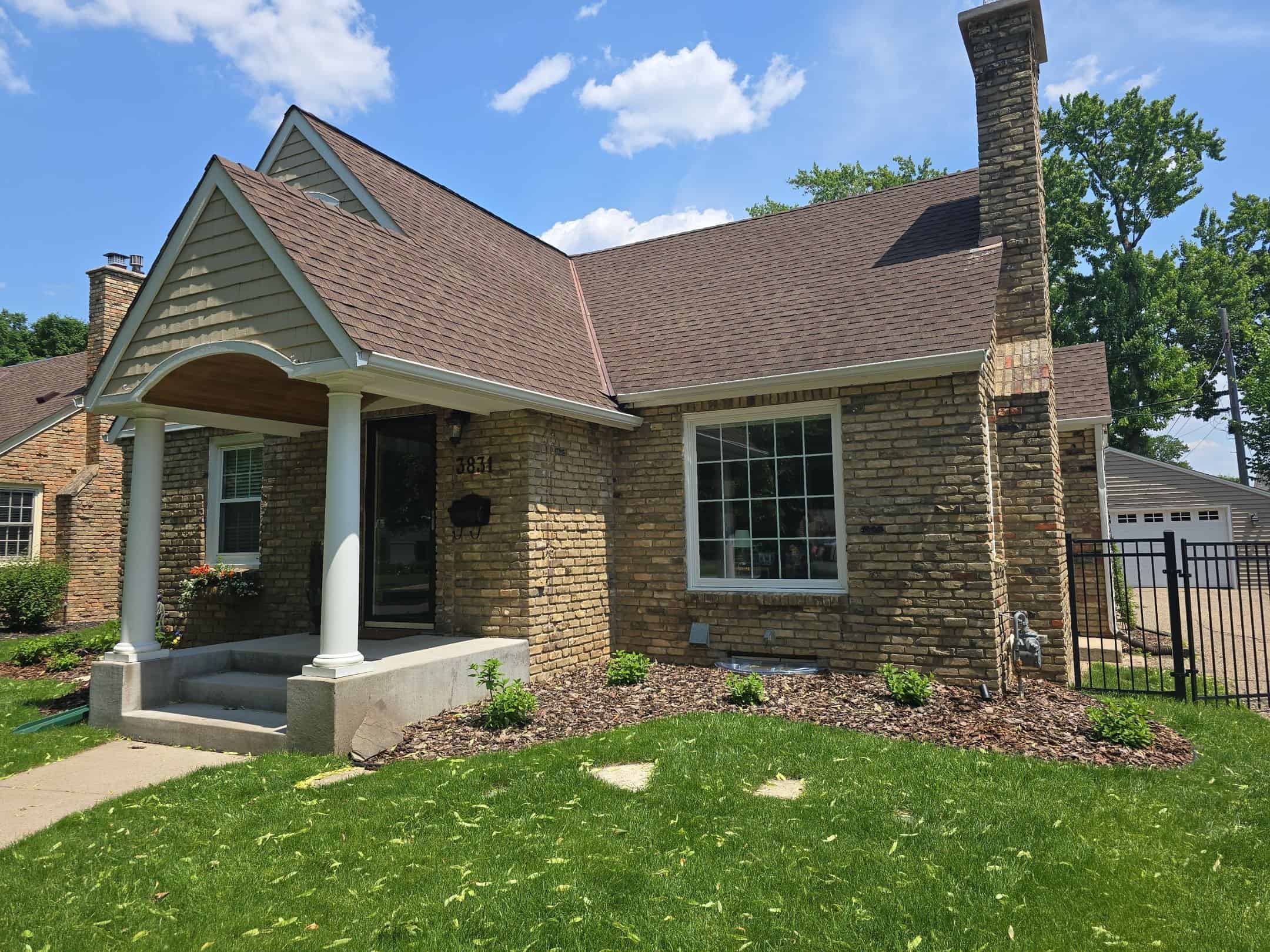 St. Louis Park, MN brick home after a roof, window, and gutter replacement