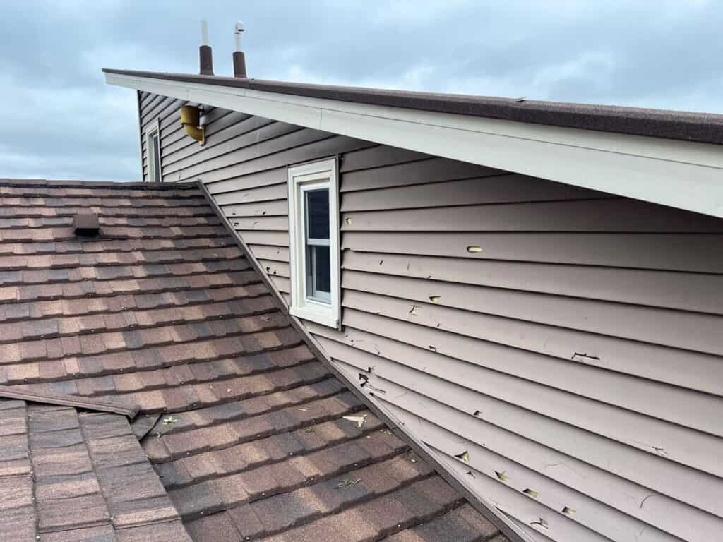 Hail damage to siding on a Minnesota home