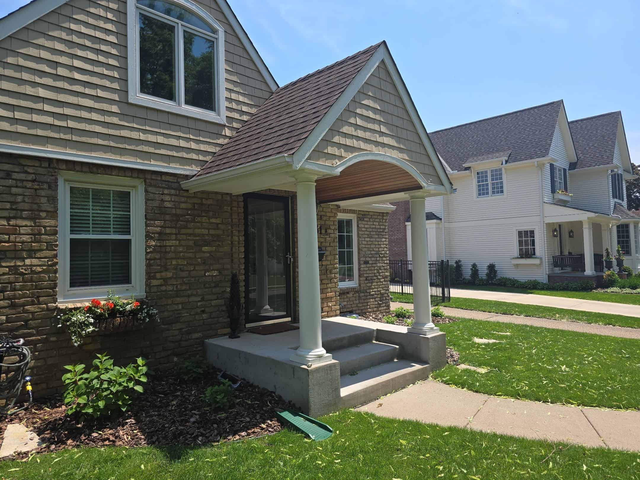 Front porch gutters and downspout after a St. Louis Park, MN gutter upgrade