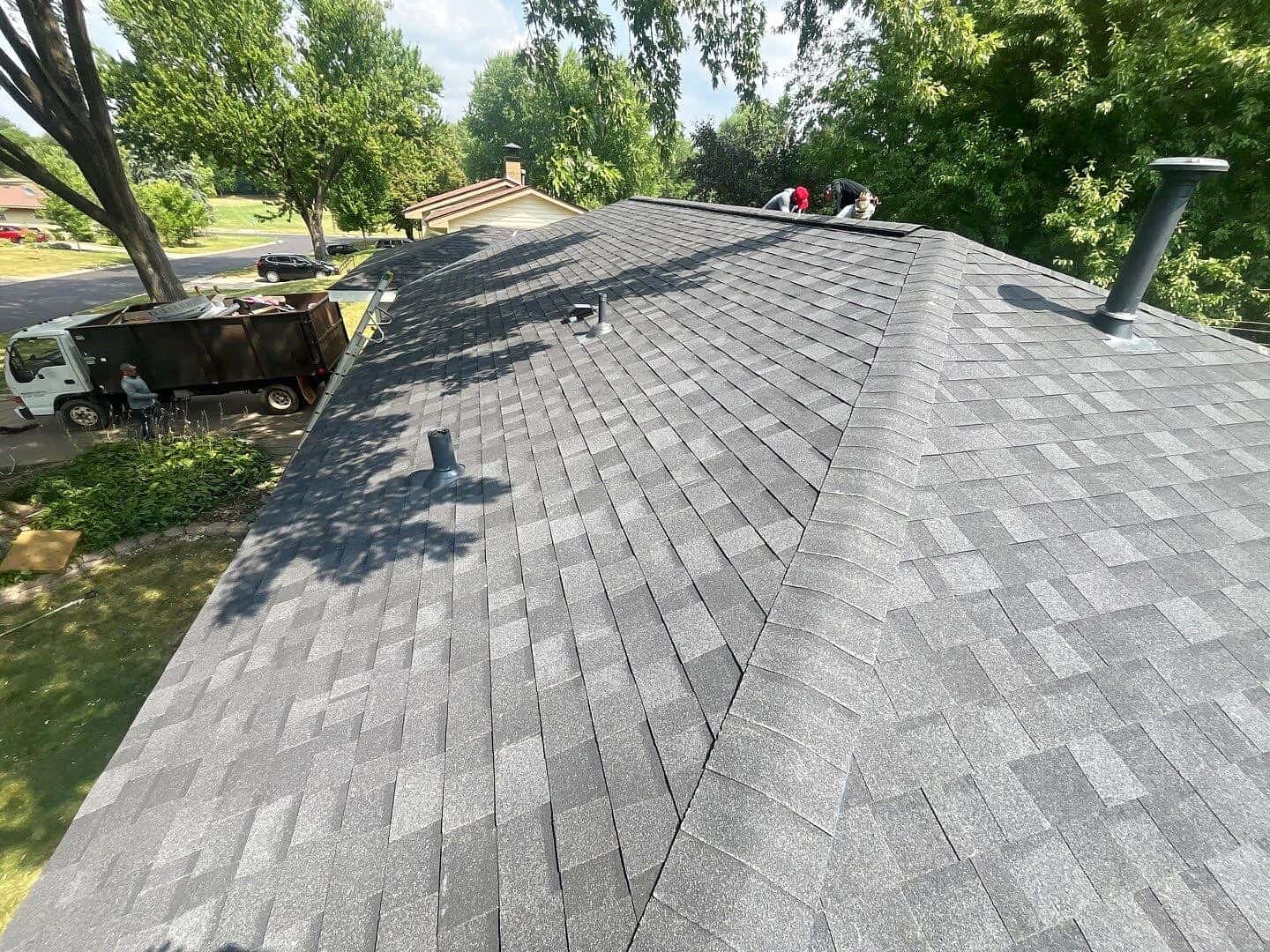 Roofing crew completing a Crystal, MN roof replacement