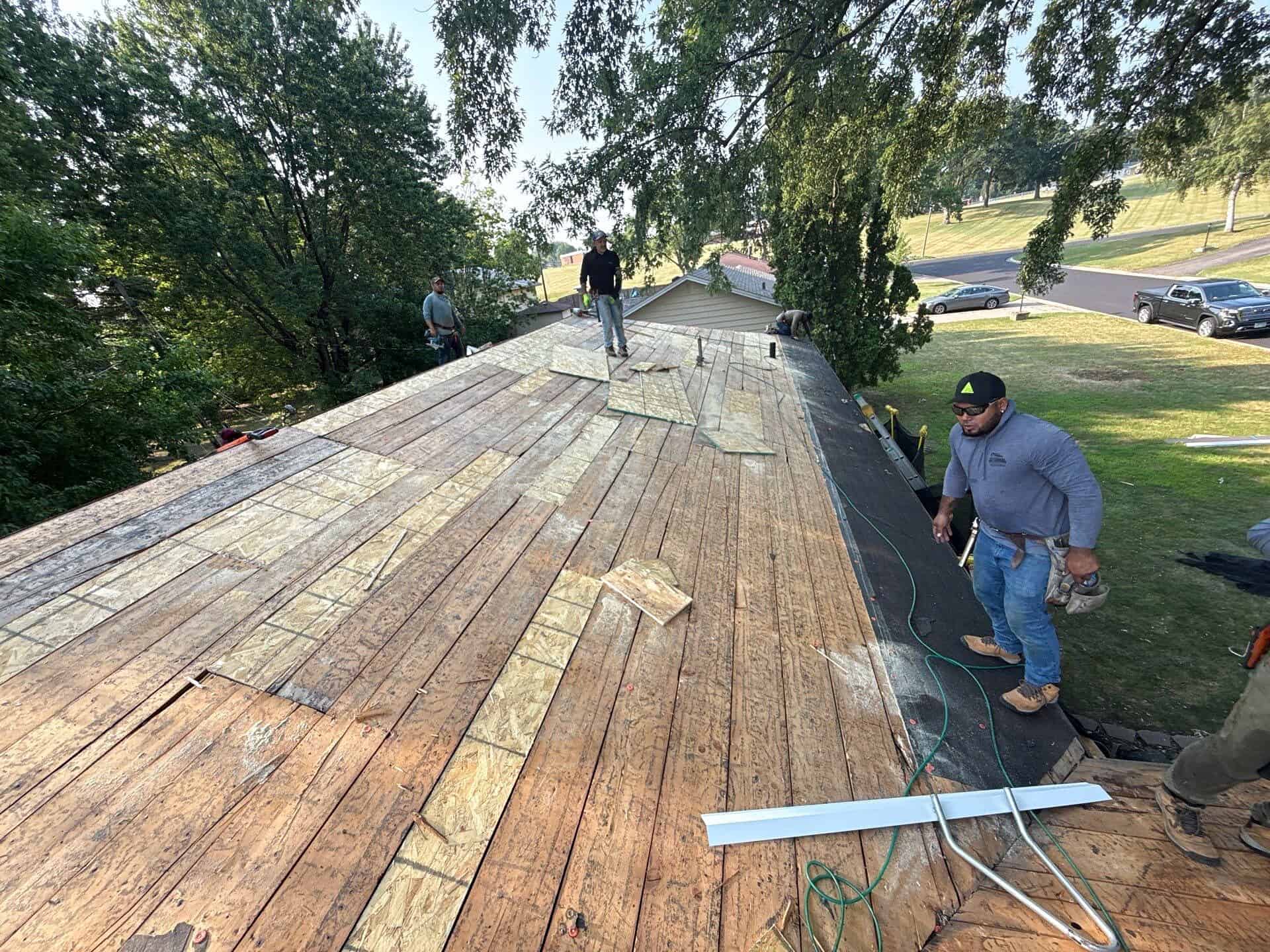 Plank roof decking with gaps exposed during tear-off in Crystal, MN