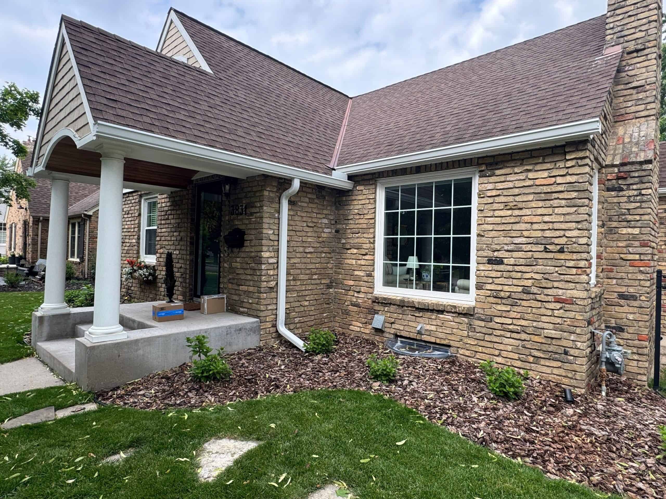 New gutters along the porch roofline of a St. Louis Park, MN home