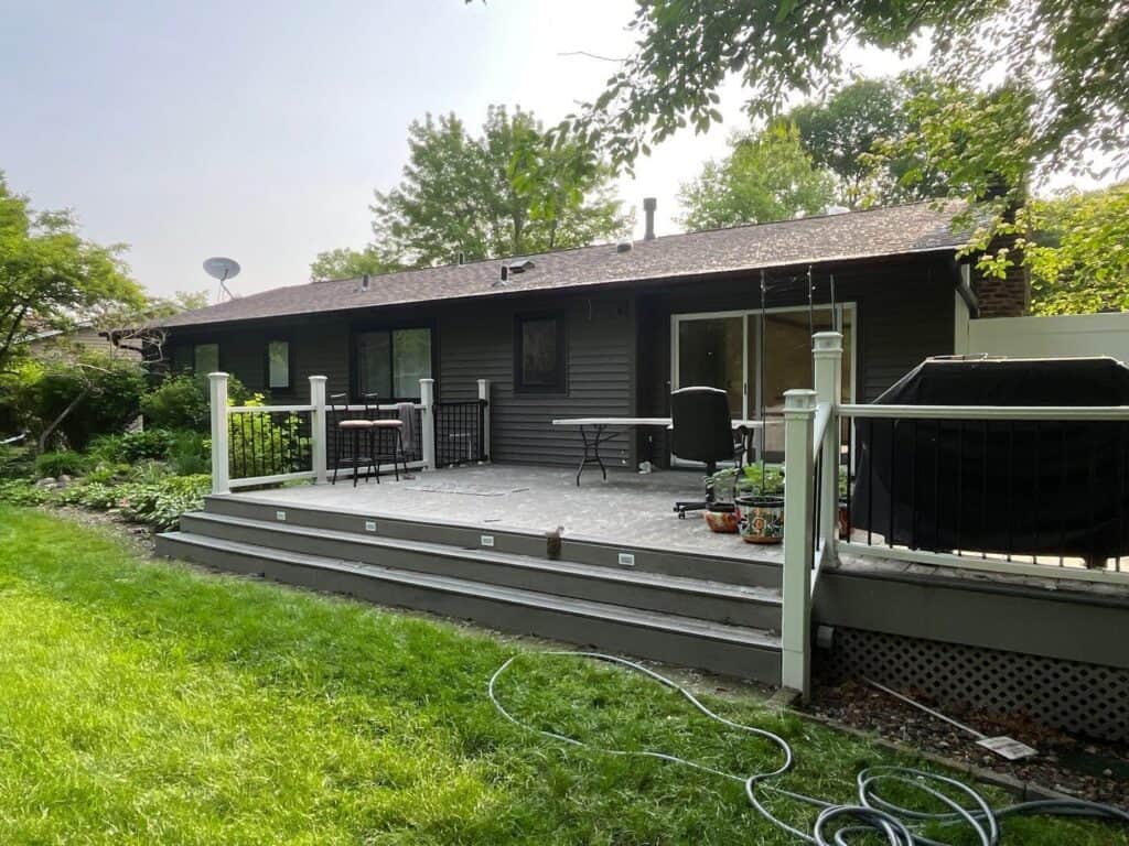 Burnsville, MN home after an Alside Charter Oak siding remodel in Smoke with new deck