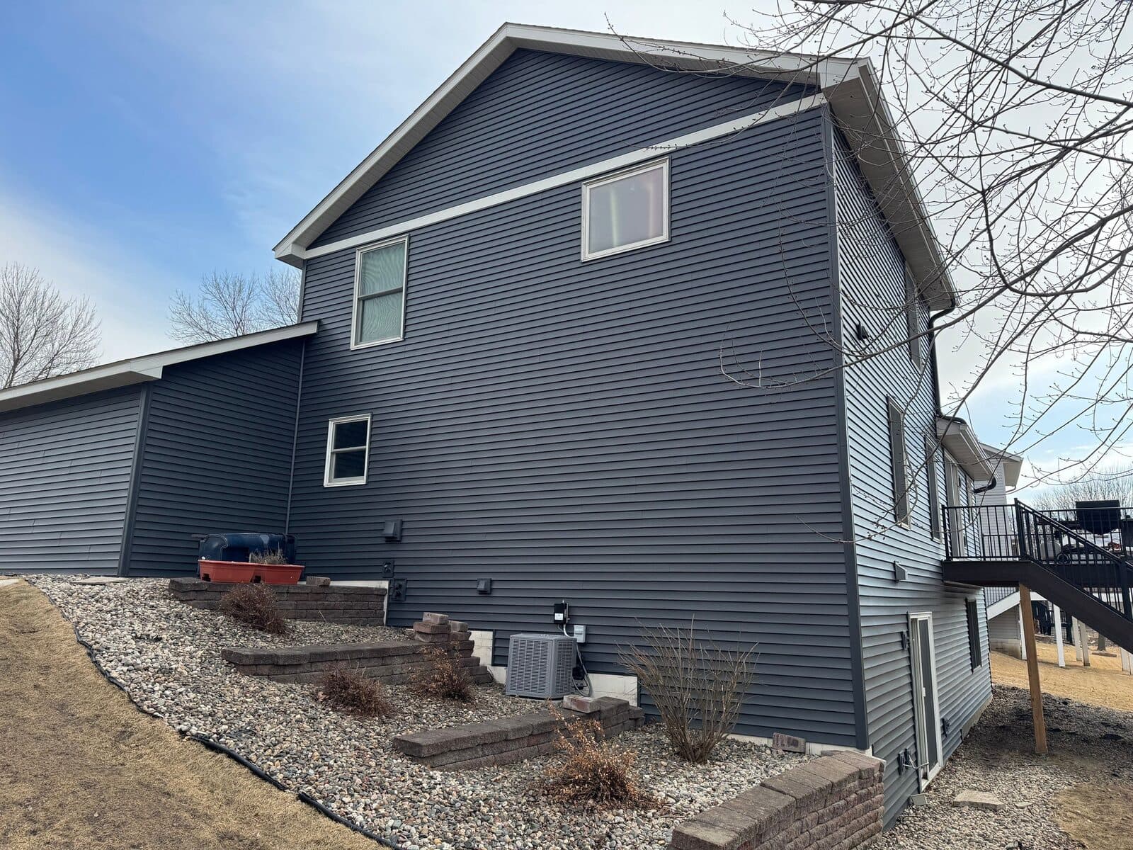 Back of a Farmington, MN home with new Deep Cavern siding and deck