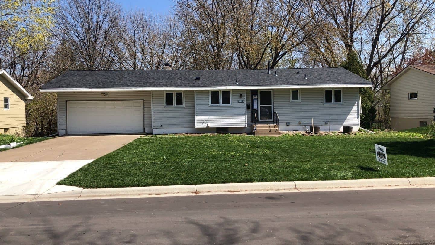 Crystal, MN home with its old white siding before the project