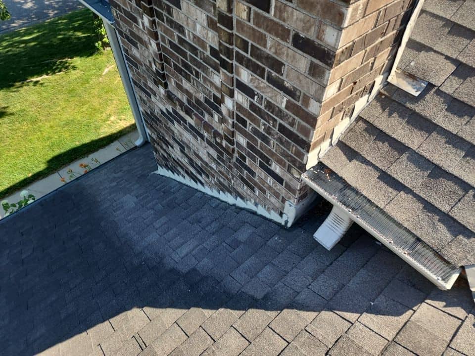 Detail work around the chimney on a Plymouth, MN roof
