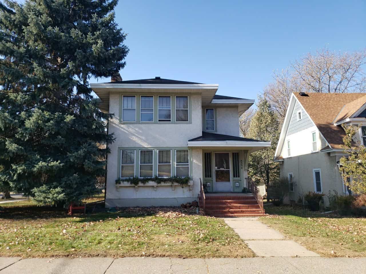 Minneapolis, MN rental home with a new Owens Corning Duration roof in Driftwood