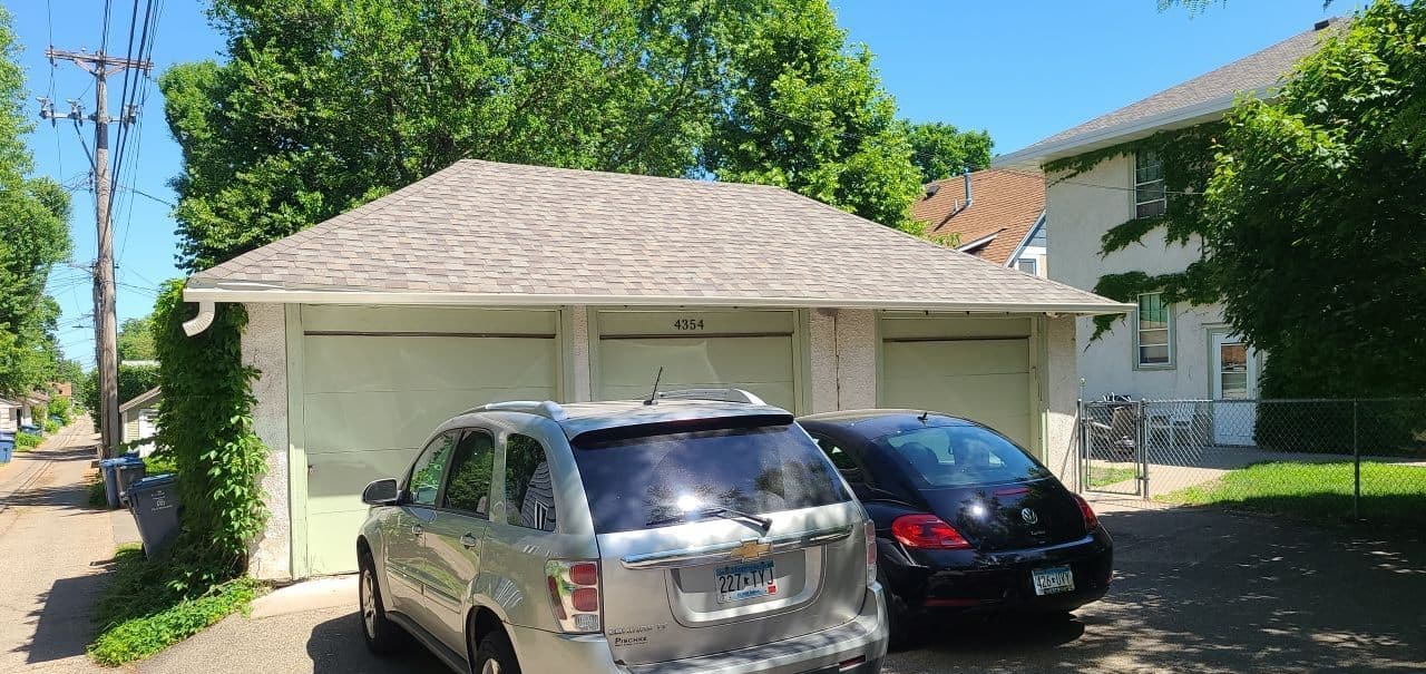 Detached garage in Minneapolis, MN before its redeck and new roof