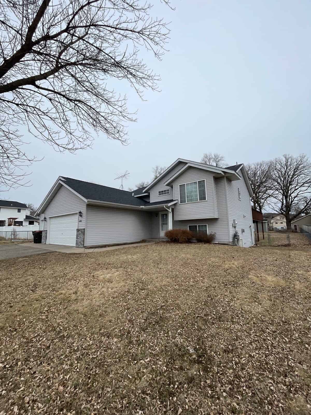 Monticello, MN rental property with a new Owens Corning Duration roof in Onyx Black