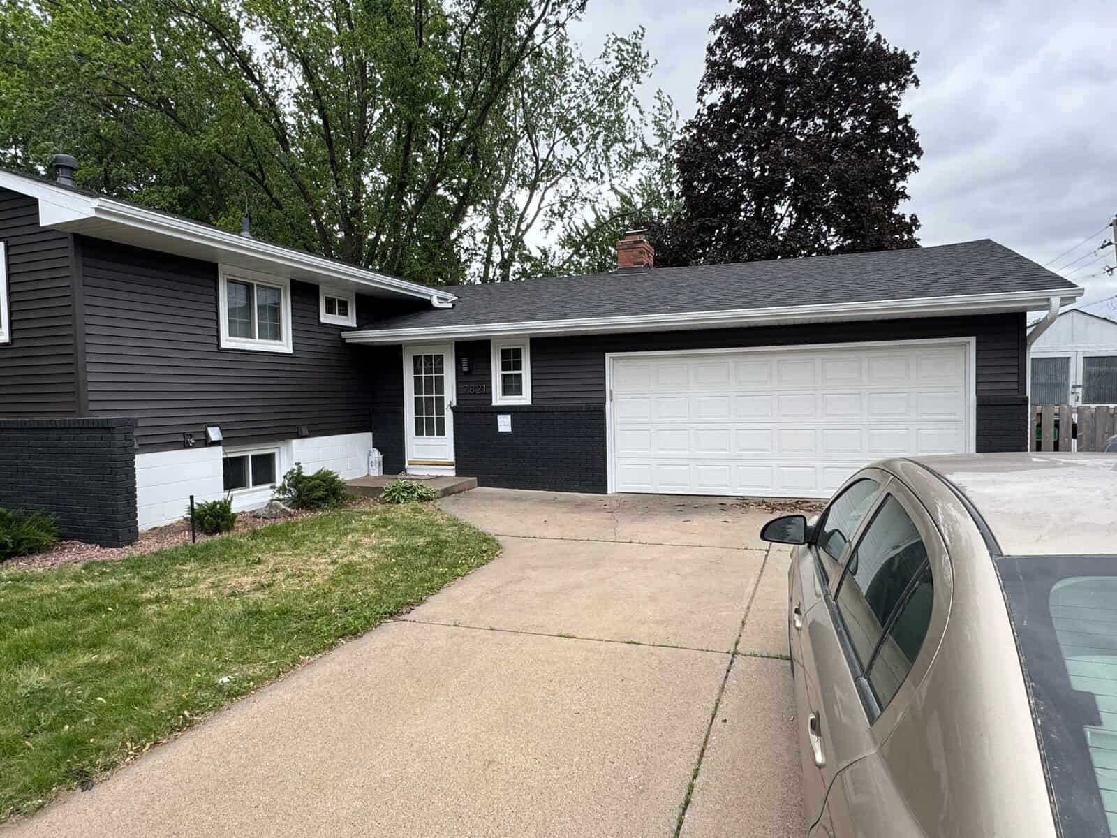 Front of a New Hope, MN home after hail damage restoration with new siding and roofing