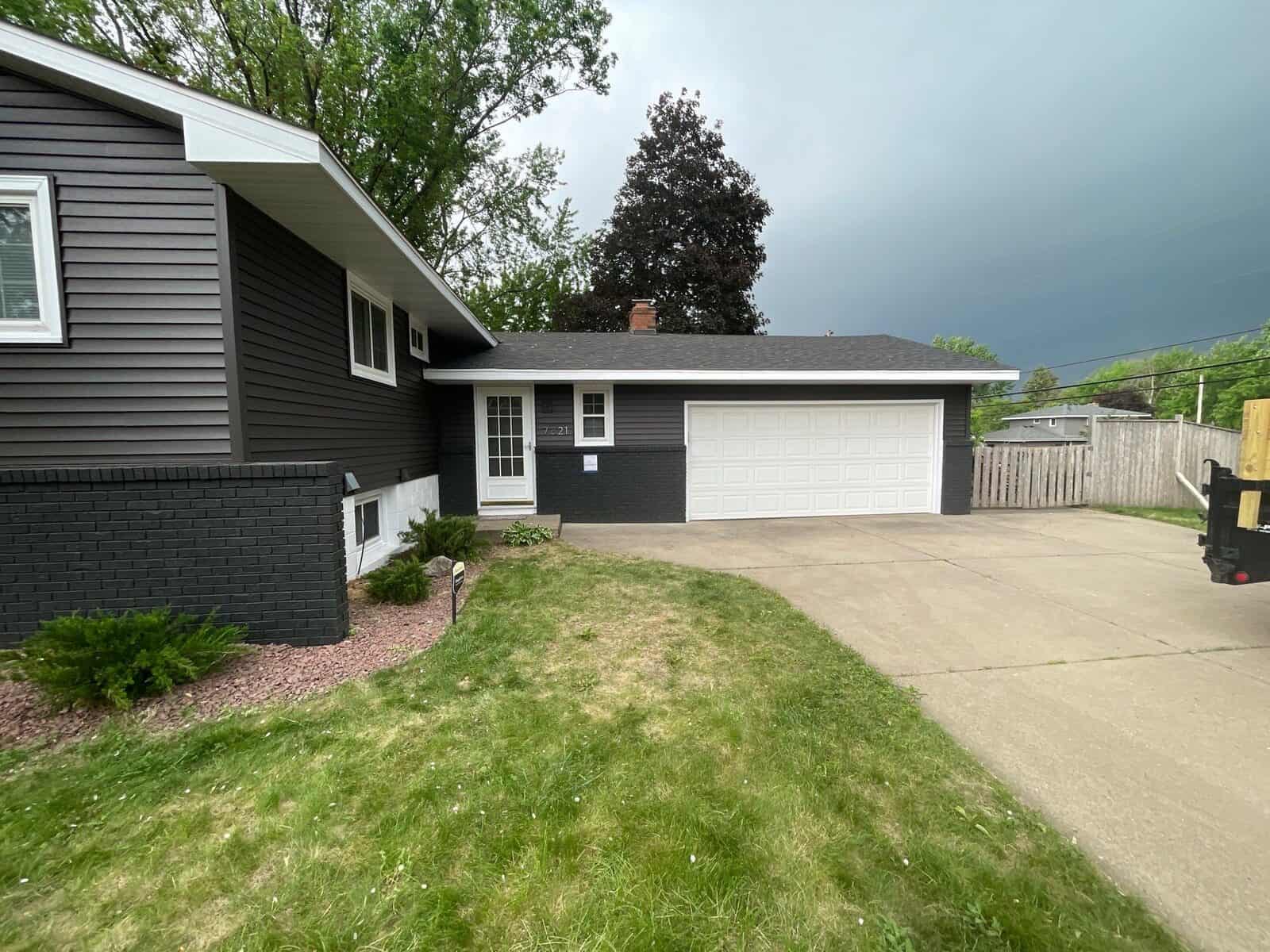 New Hope, MN home with new Slate siding, soffit, and fascia from the backyard