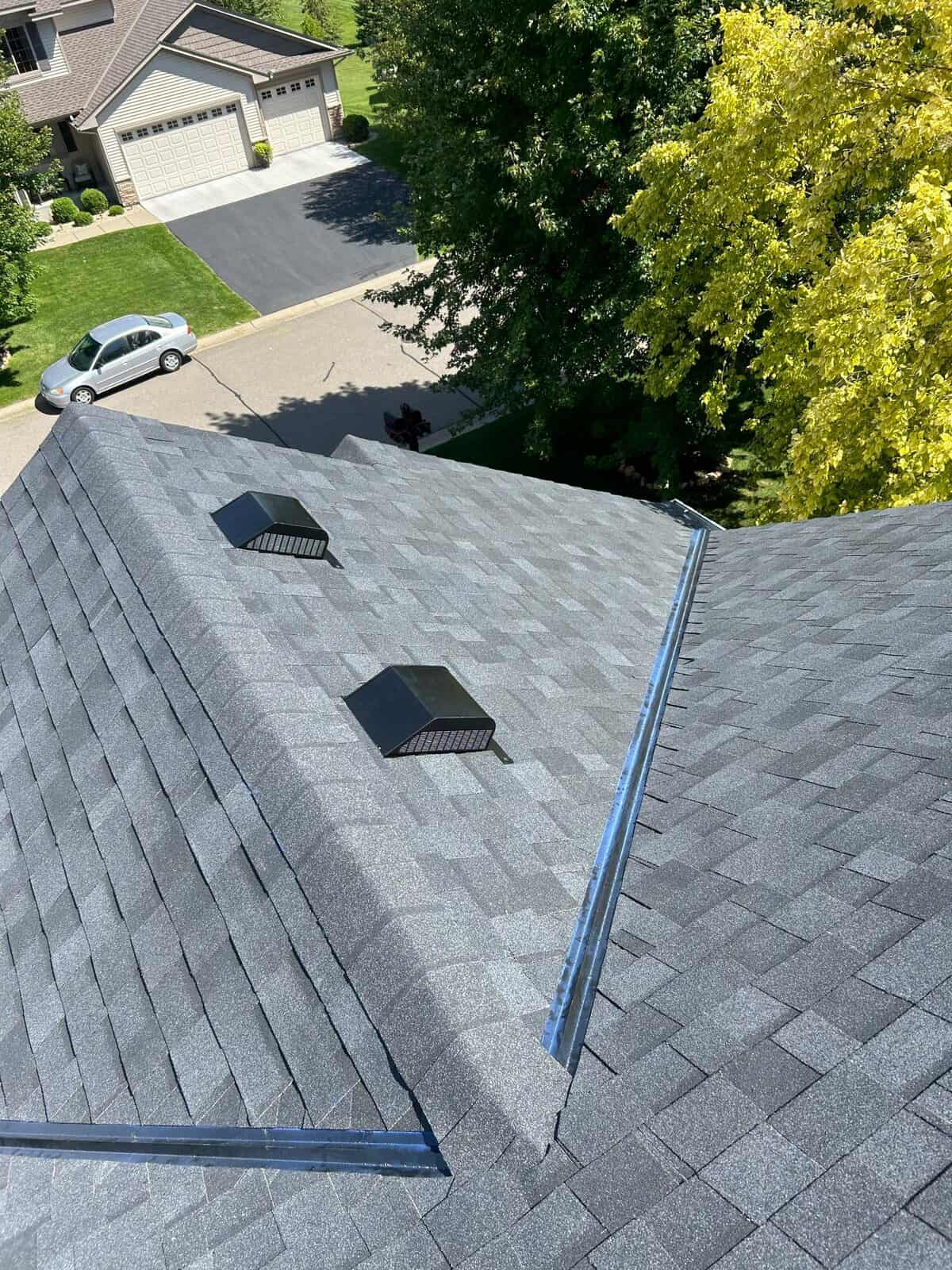 Aerial view of the finished Onyx Black roof on a St. Michael, MN home
