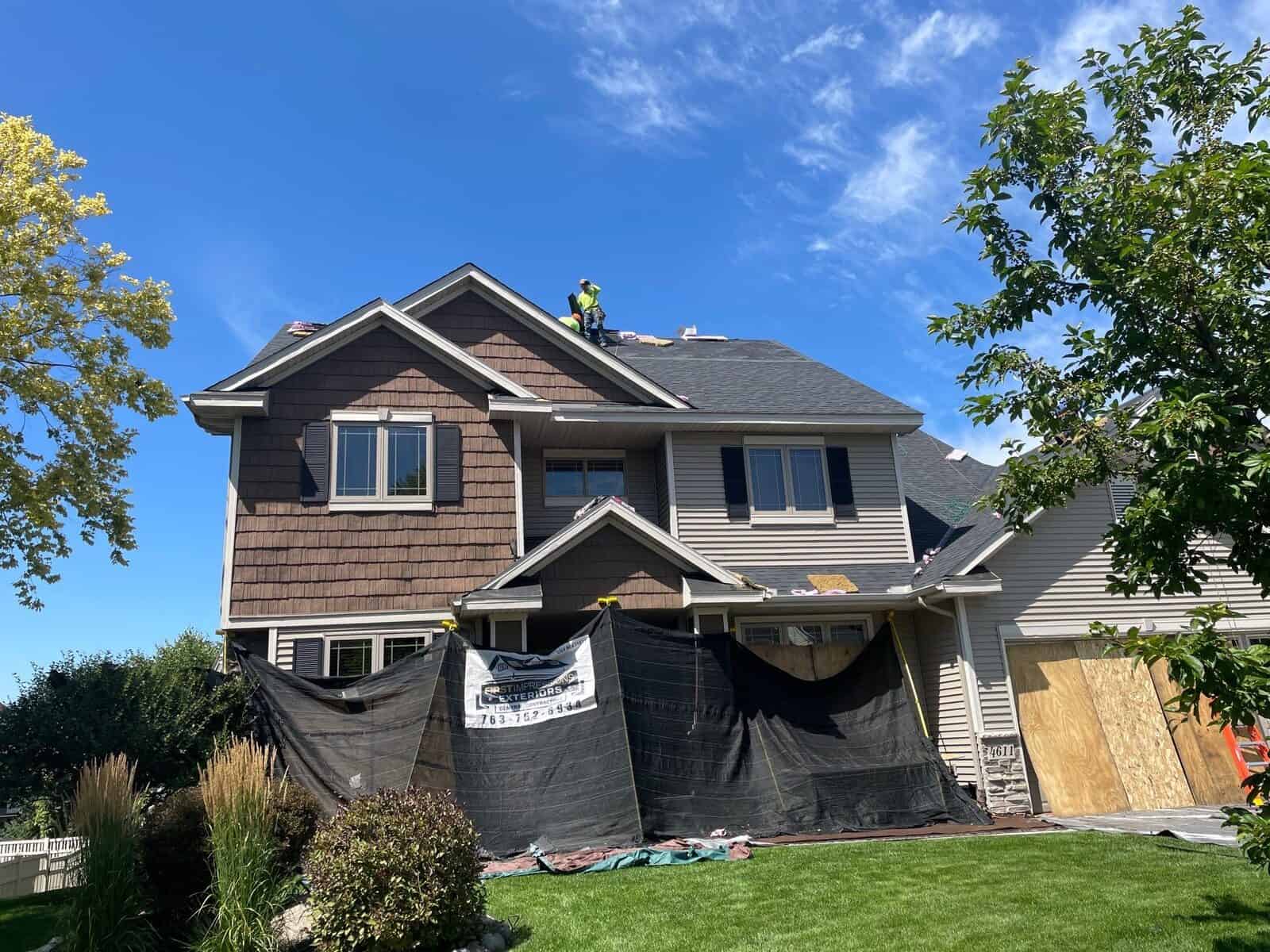 Install day on a St. Michael, MN roof with the front yard protected