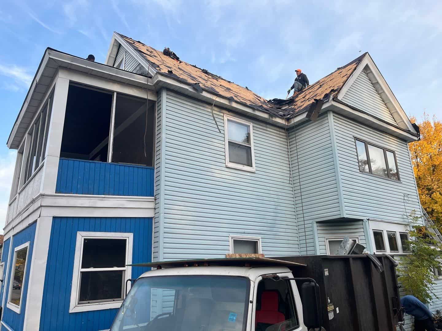 Tear-off day on the steep back slope of a St. Paul, MN rental