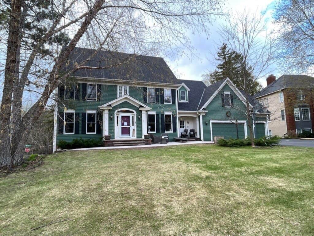 Woodbury, MN home with a new Owens Corning Duration roof in Onyx Black on a steep roofline