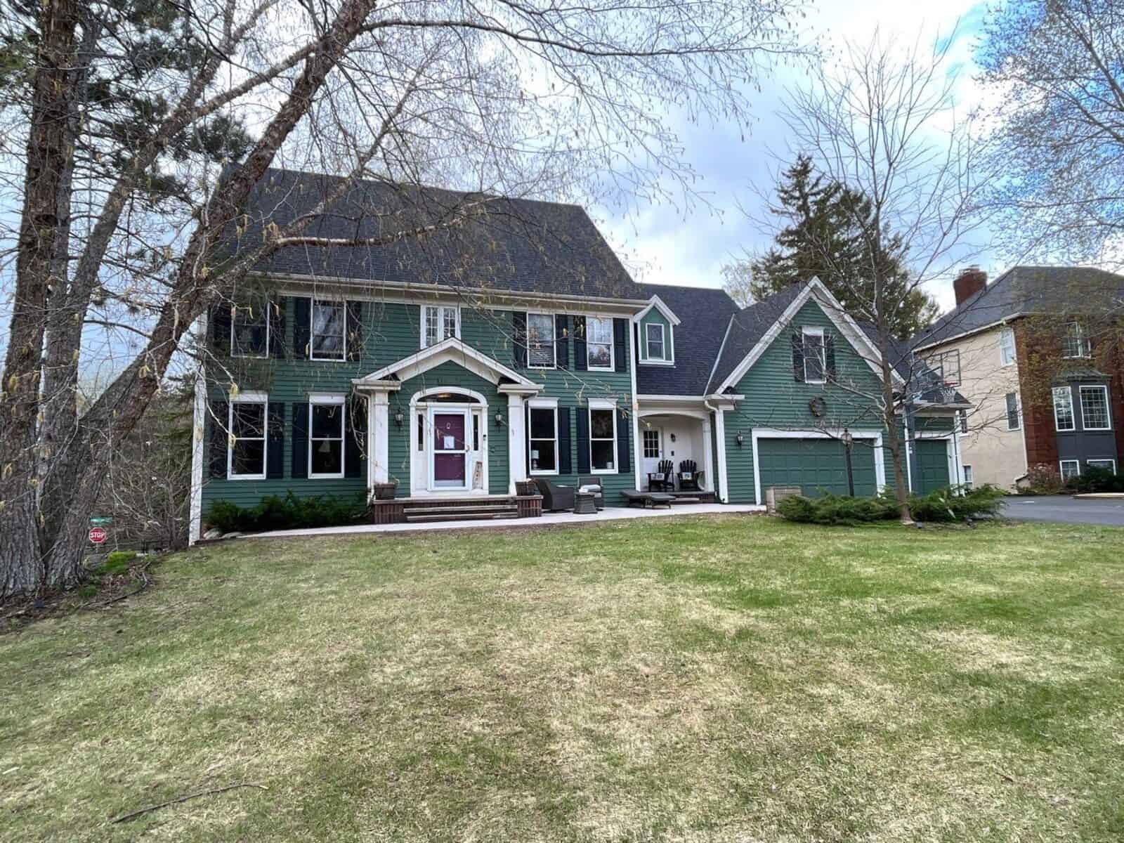 Woodbury, MN home with a new Owens Corning Duration roof in Onyx Black on a steep roofline