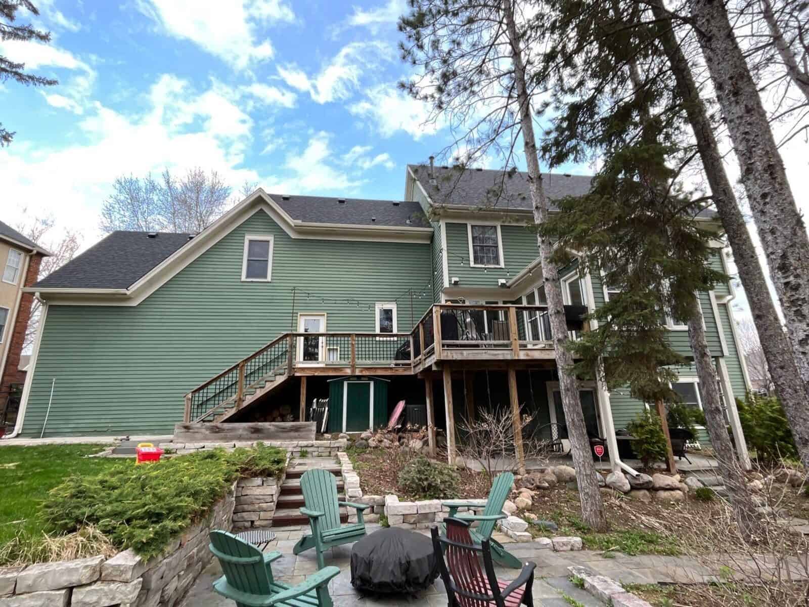 Back of a Woodbury, MN home with a finished Duration roof over the deck