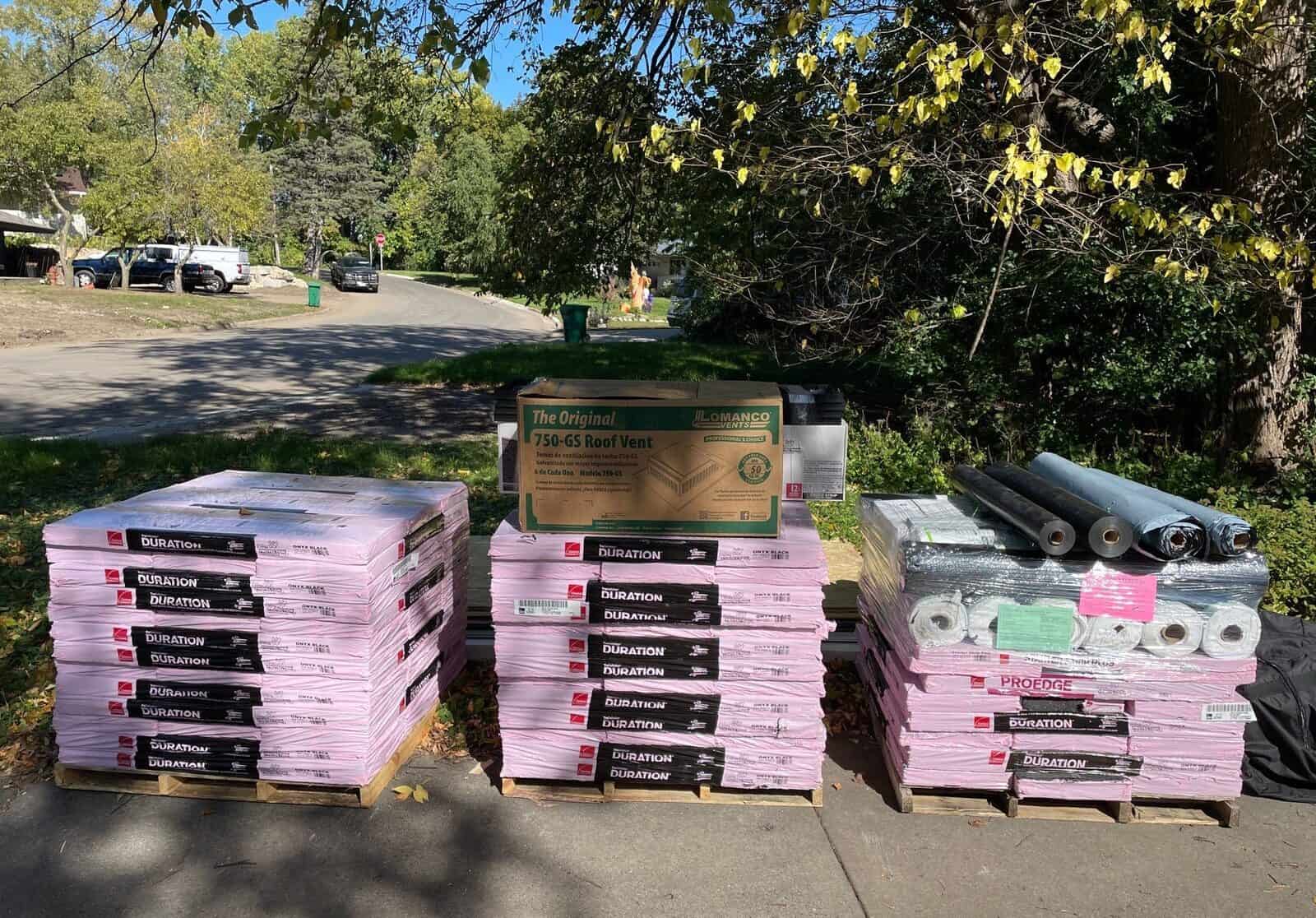Owens Corning shingle pallets staged for a Minneapolis, MN roof replacement