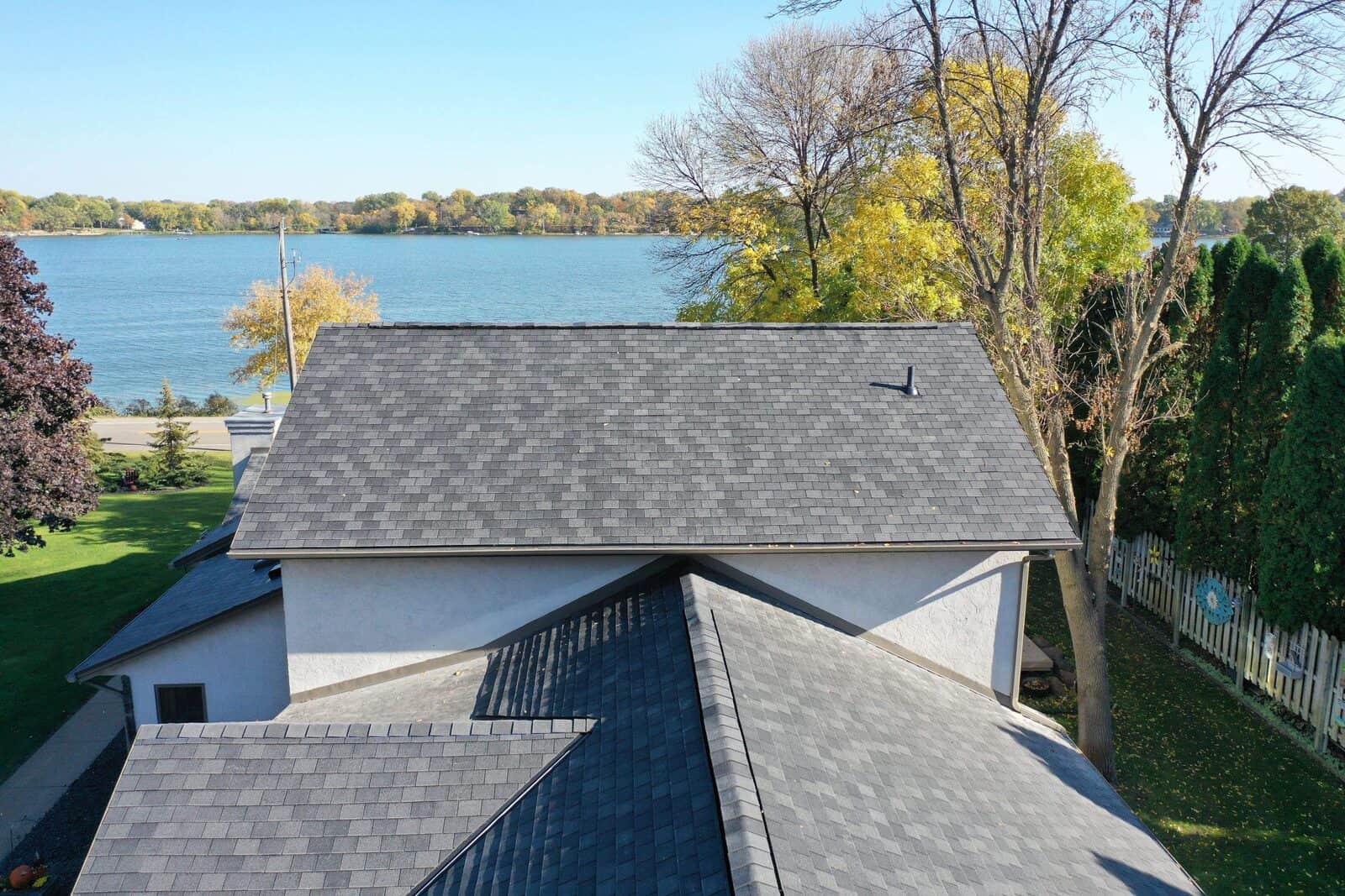 Lake-side view of a Little Canada, MN home with a new F-Wave Designer Slate roof