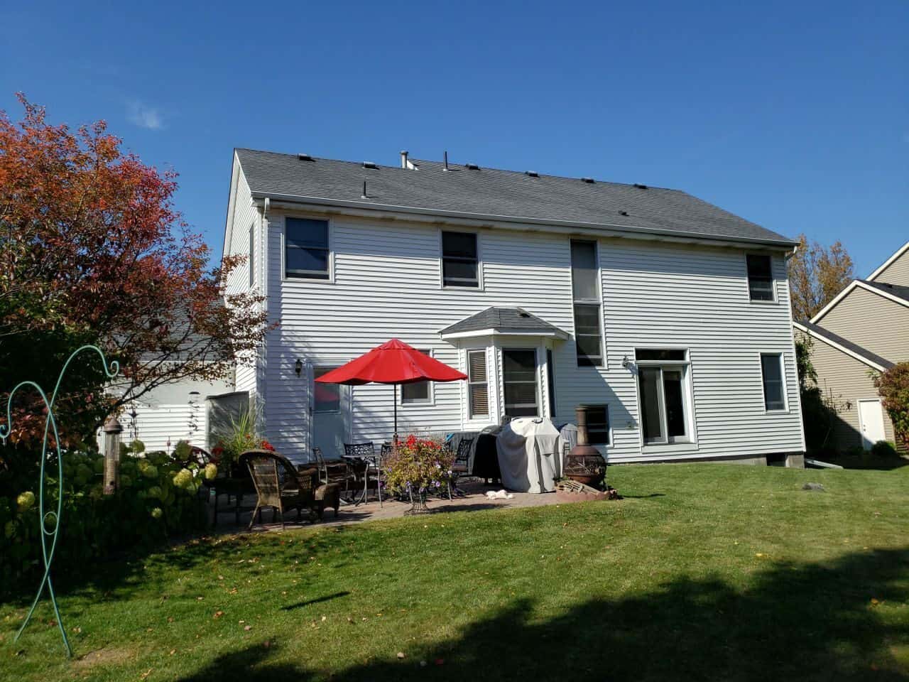 Back of an Eden Prairie, MN home with its new Charcoal roof and patio