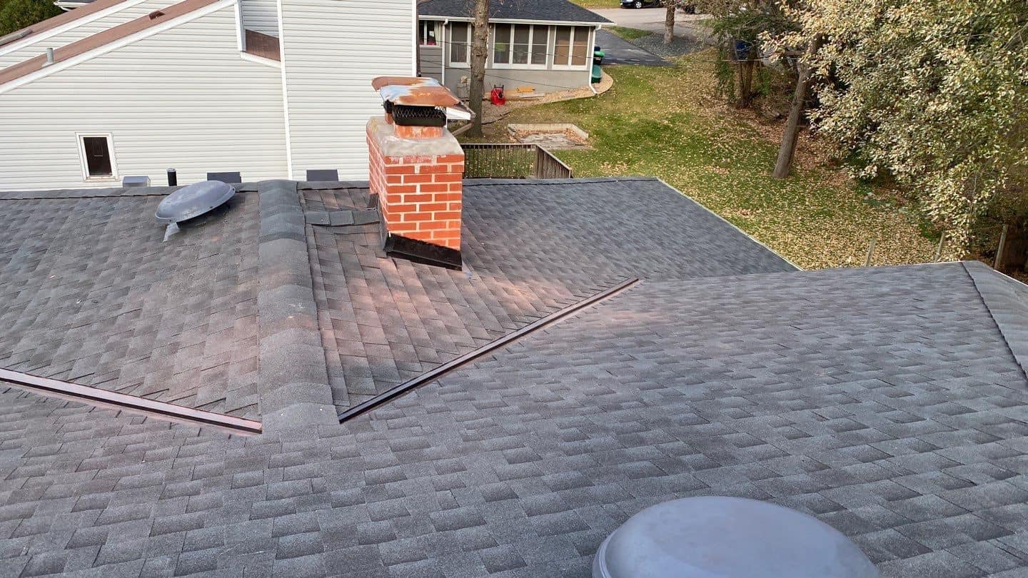 Another angle of the new Charcoal roof and brick chimney in Edina, MN