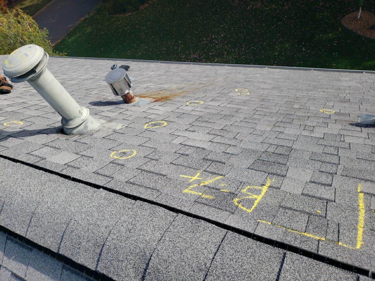 Hail hits marked on the old roof during the insurance inspection