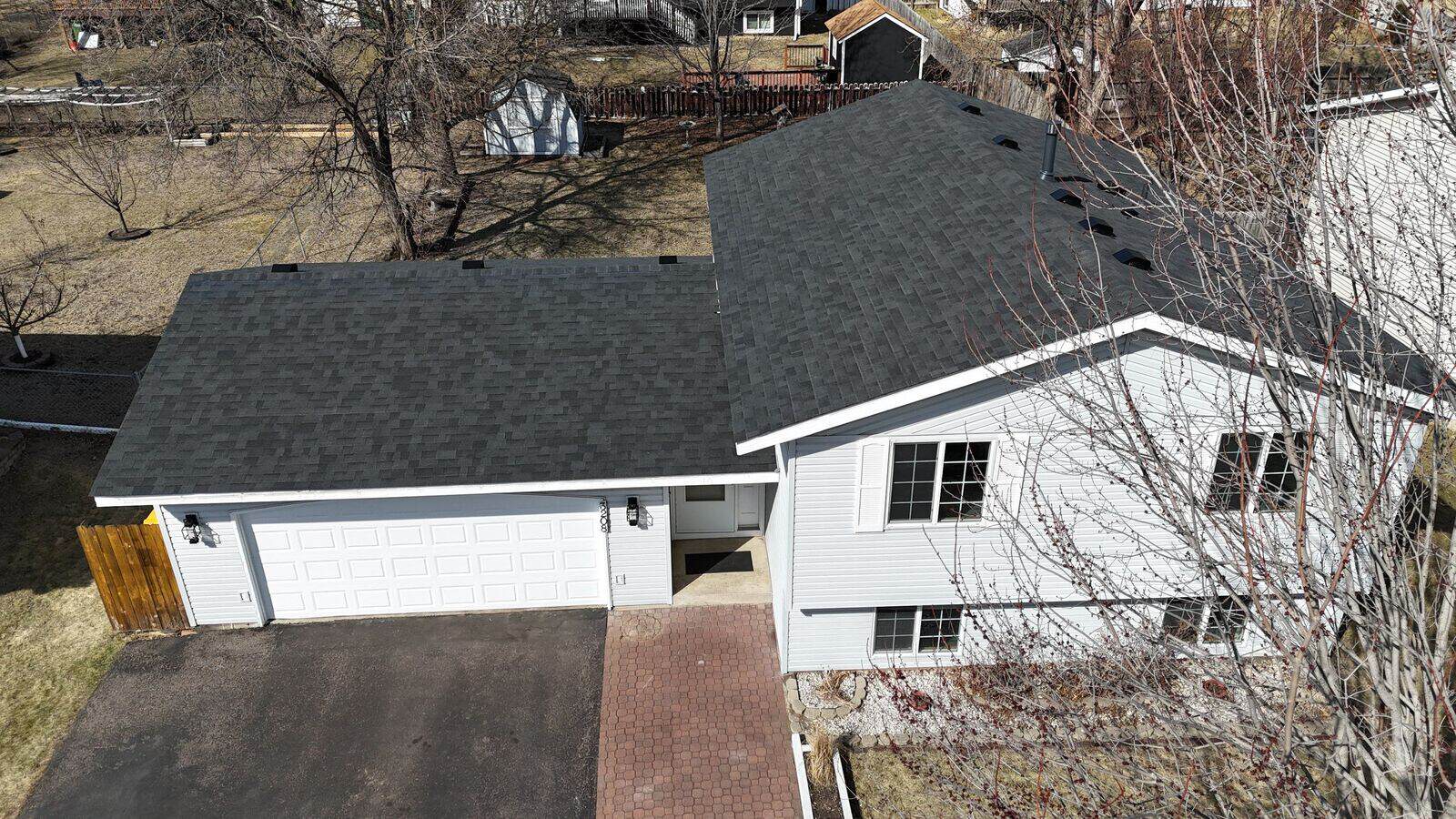 Malarkey Highlander shingles in Brilliant Black on the garage side
