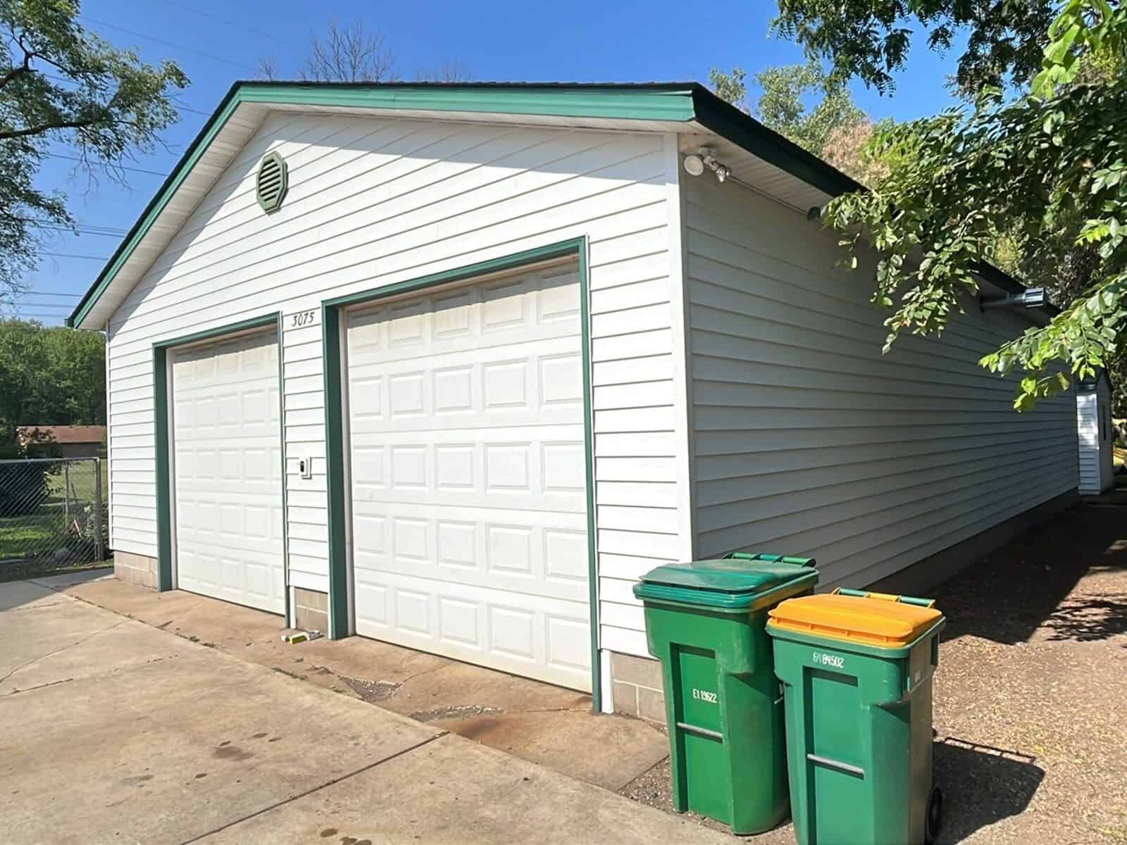 Detached garage with new Glacier White steel siding in Little Canada, MN