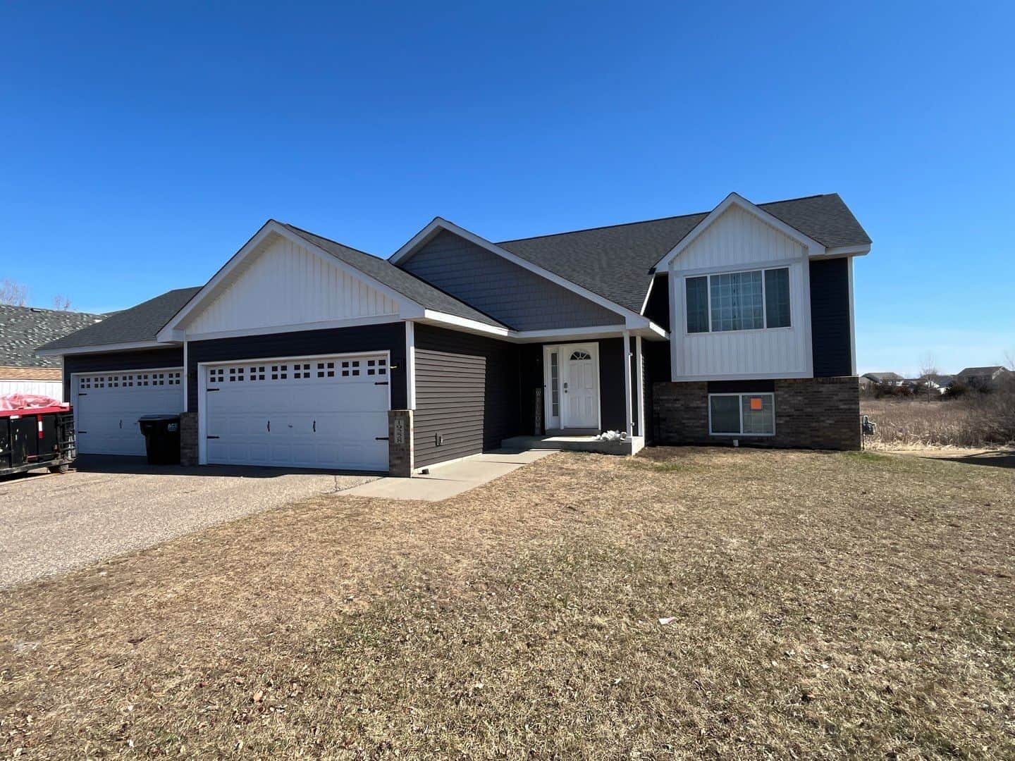 Big Lake, MN home with a new CertainTeed Landmark roof in Moire Black, new siding, and new gutters