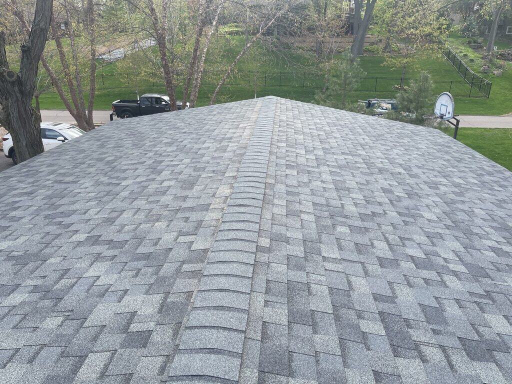 Minnetonka, MN home after a hail damage roof replacement with Owens Corning Duration shingles in Estate Gray