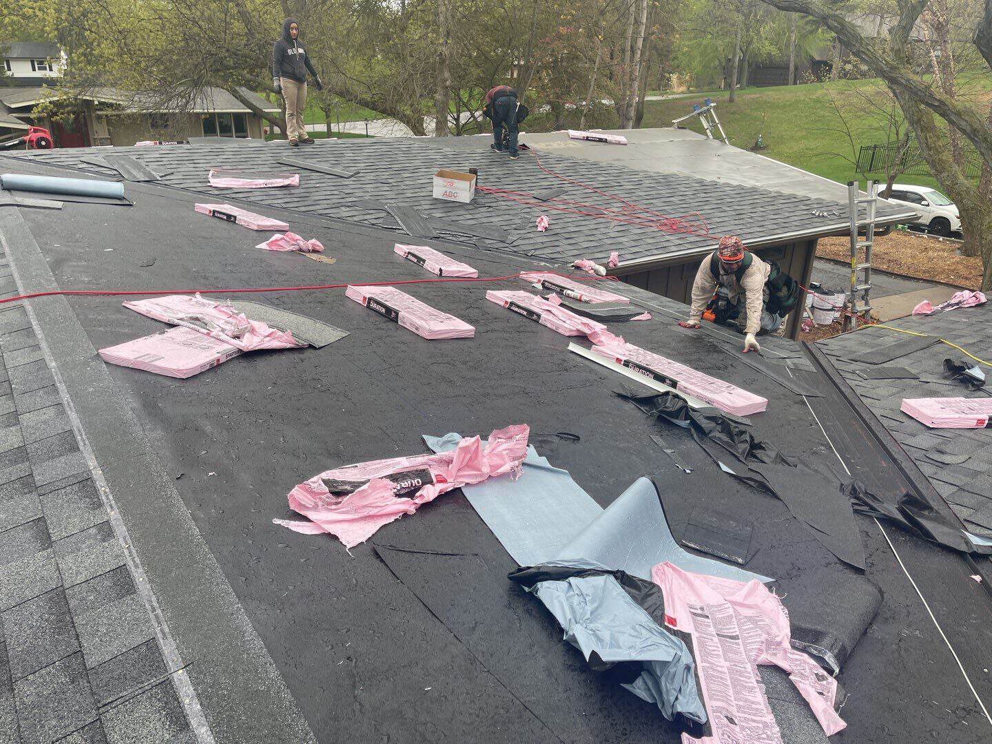 Tear-off in progress during a Minnetonka, MN hail damage roof replacement