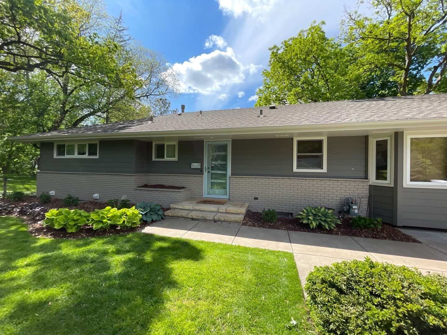 Front of a Hopkins, MN home with new LP SmartSide ExpertFinish siding in Tundra Gray
