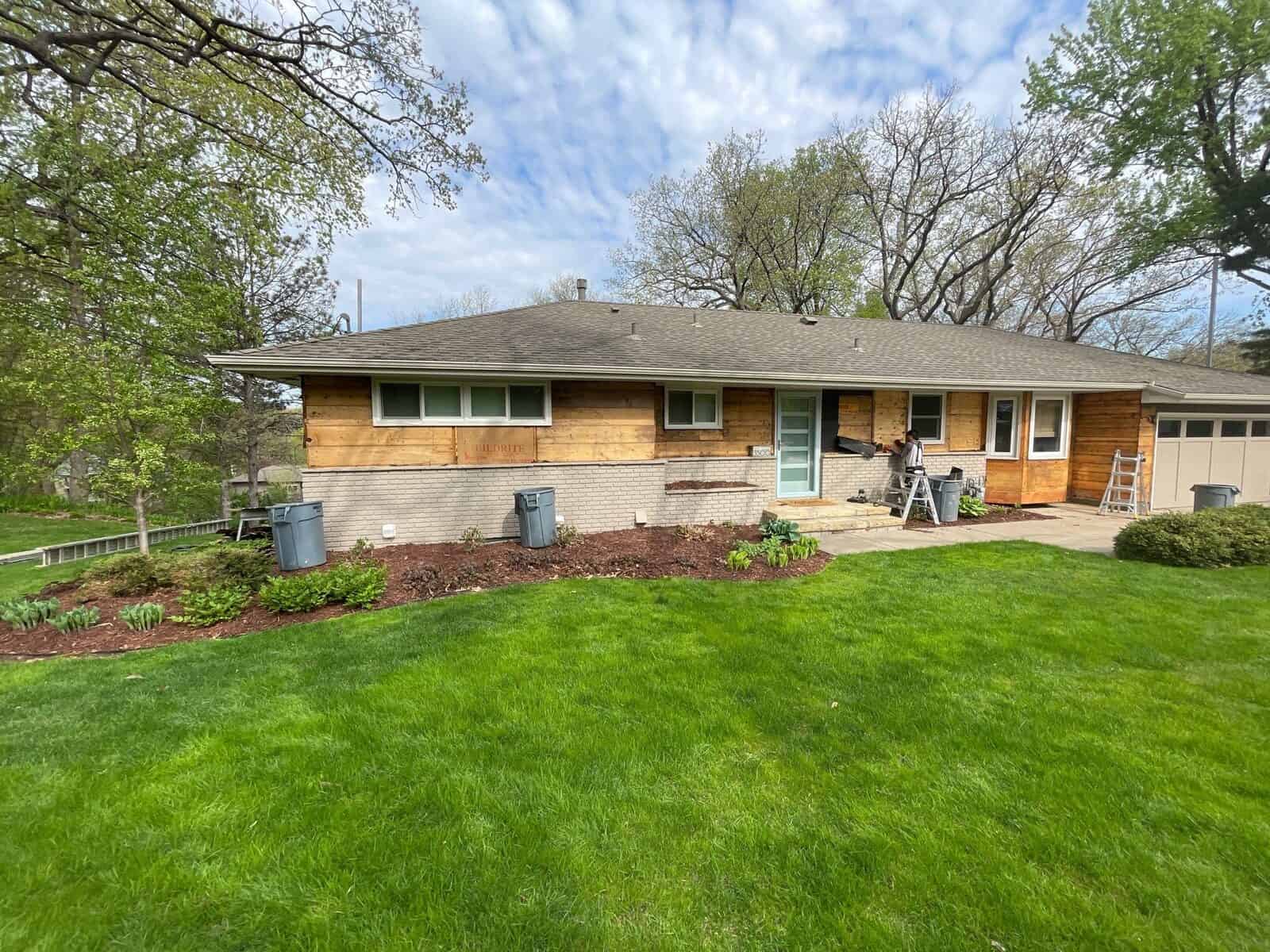 Wide front view of a completed residing project in Hopkins, MN