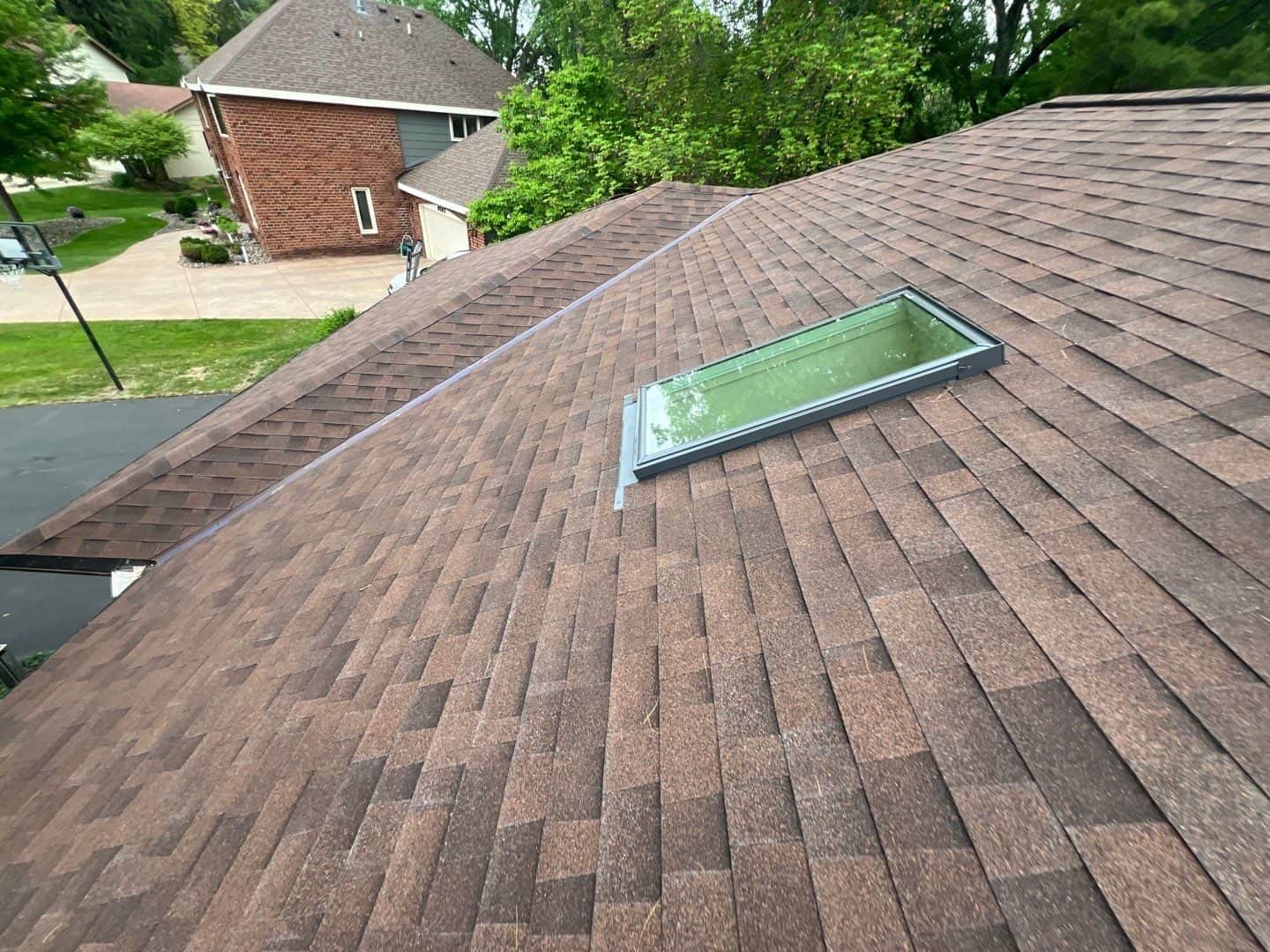 New Velux skylight installed in a Malarkey Vista Antique Brown roof in Bloomington, MN