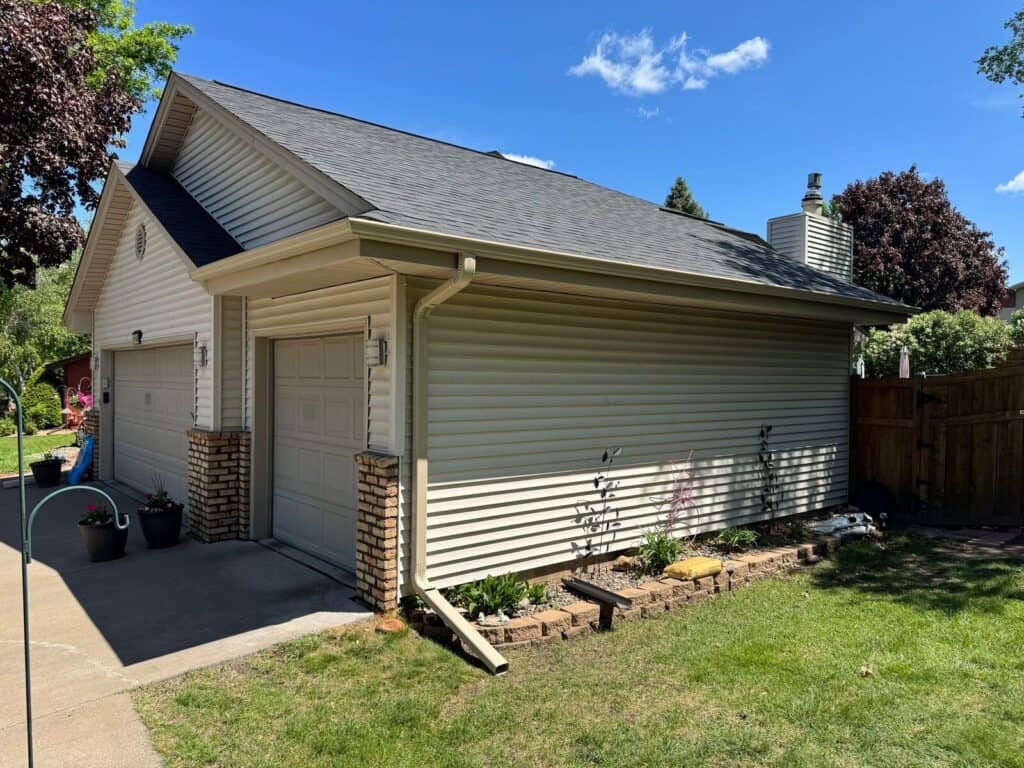 Plymouth, MN home after a roof replacement with Malarkey Vista shingles in Brilliant Black