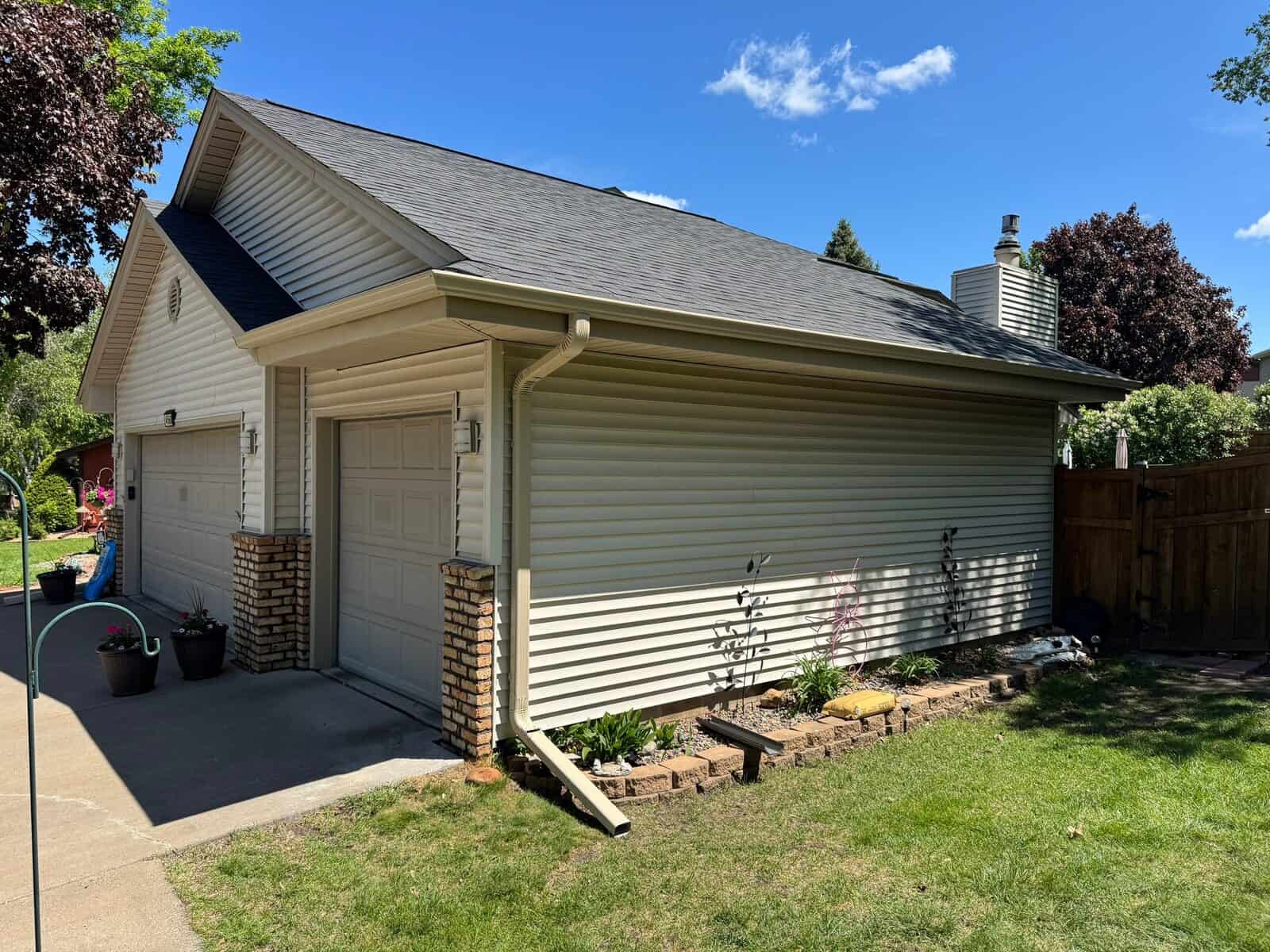 Plymouth, MN home after a roof replacement with Malarkey Vista shingles in Brilliant Black
