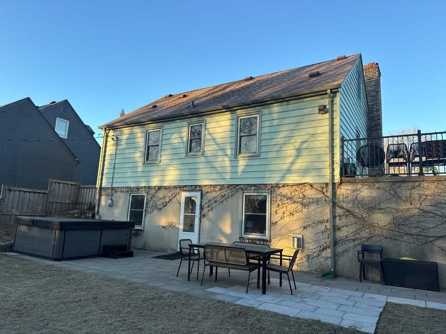Rear addition with new siding and low-slope roof in St. Louis Park, MN
