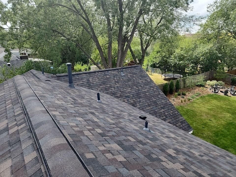 Golden Valley, MN home after a storm damage roof replacement with Owens Corning Duration shingles in Black Sable