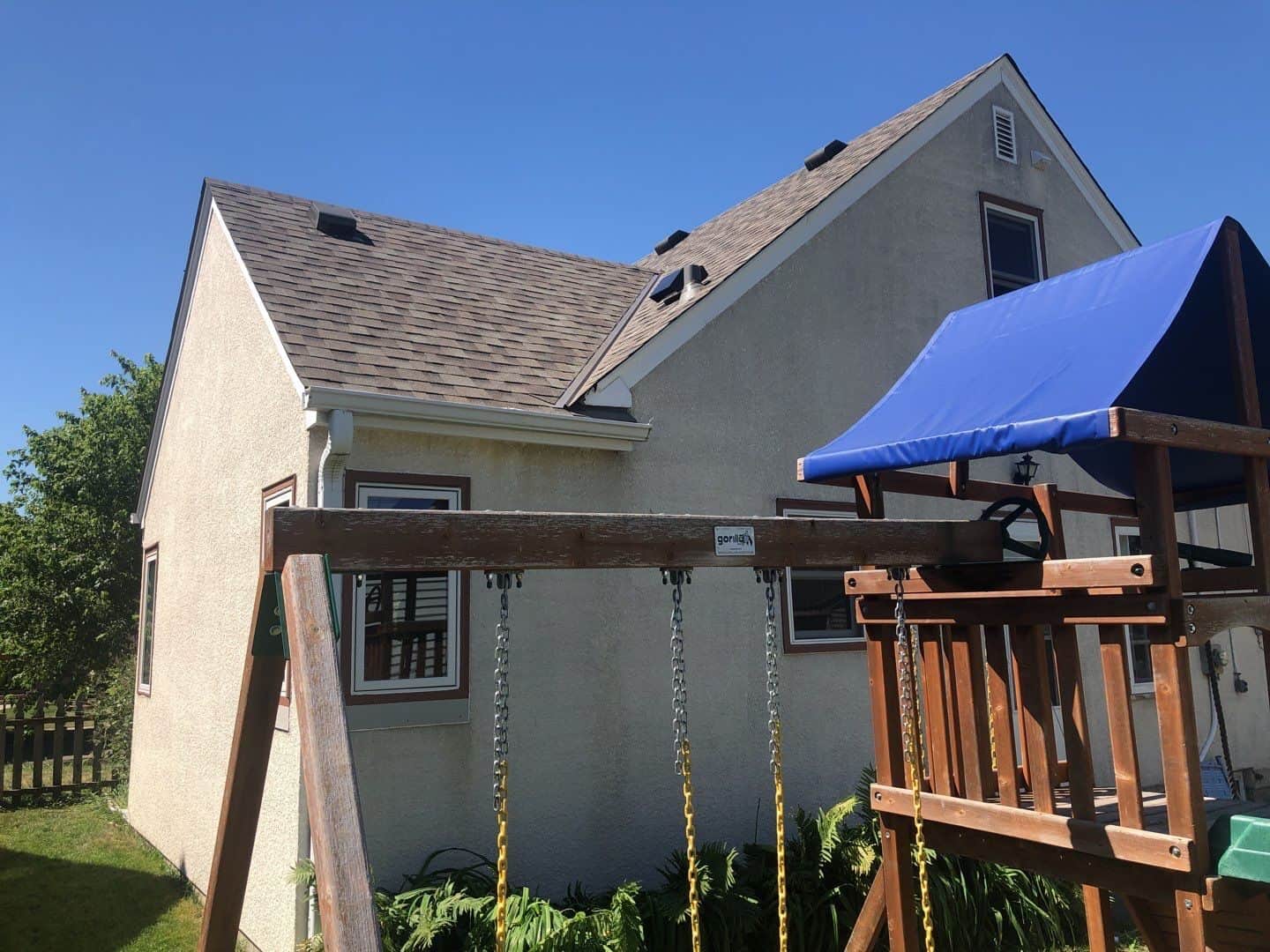 Backyard view of a St. Paul, MN home before its roof replacement