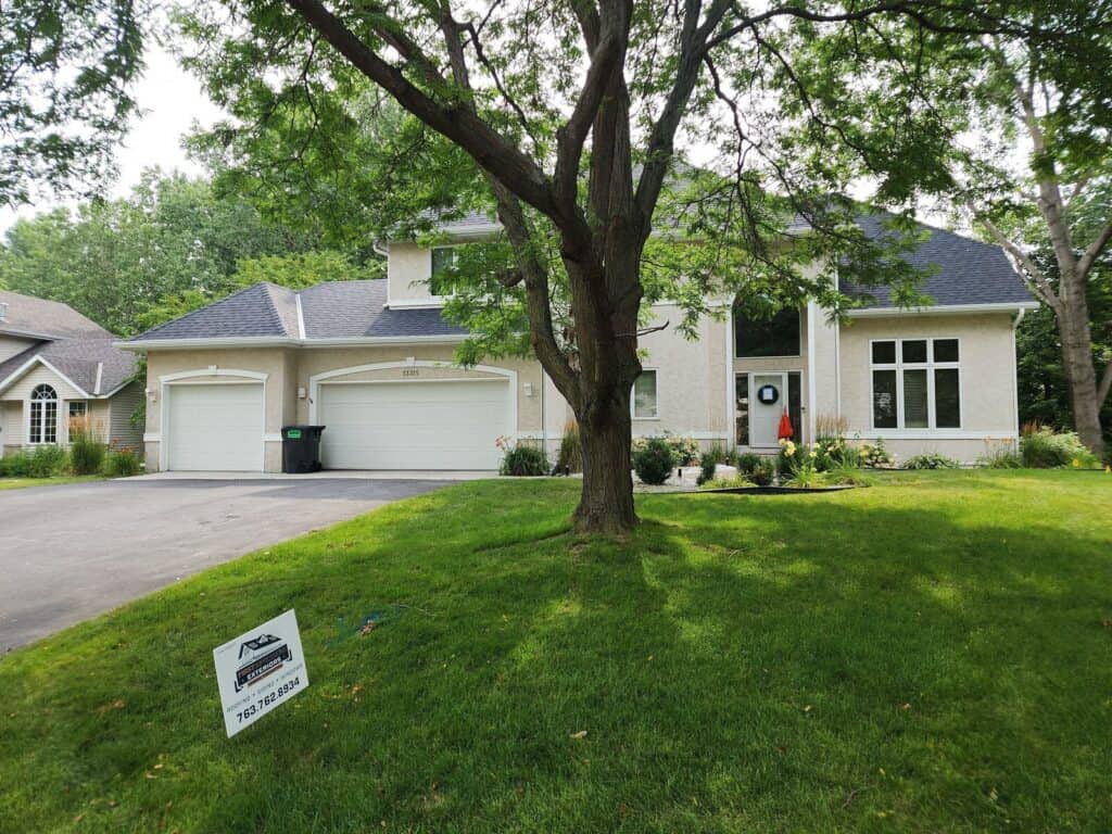 Plymouth, MN home with a new Owens Corning Onyx Black roof and Leaf Sentry gutter guards