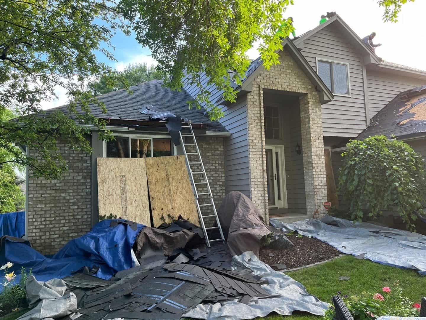 Tear-off cleanup with landscaping protected during a Plymouth, MN roofing project