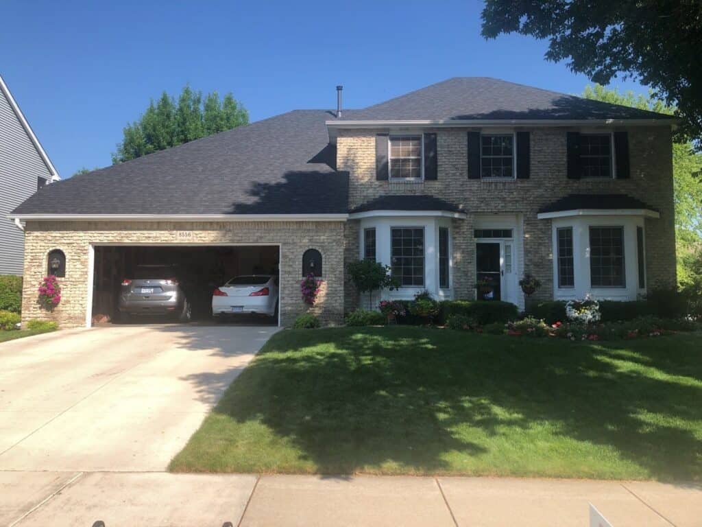Eden Prairie, MN home after a hail damage roof replacement with Owens Corning Duration shingles in Onyx Black
