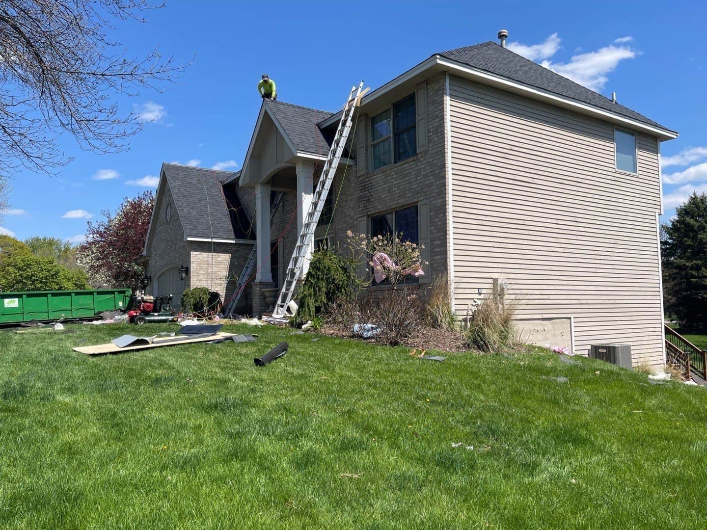 The crew at work on the steep slopes of an Eden Prairie, MN re-roof