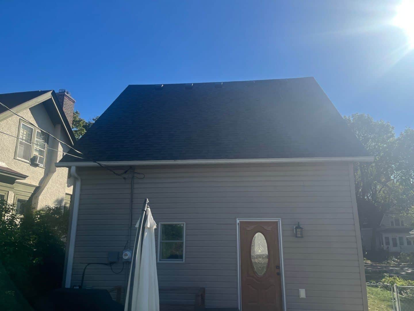 Back of a Minneapolis, MN home with its new Peppercorn roof
