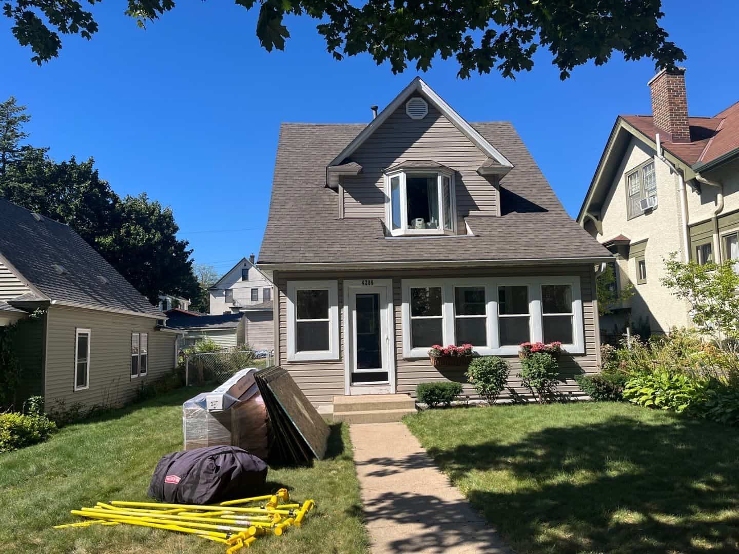 Materials staged in front of a Minneapolis, MN home before its roof replacement